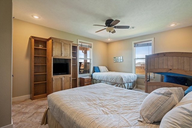 bedroom with recessed lighting, multiple windows, visible vents, and baseboards