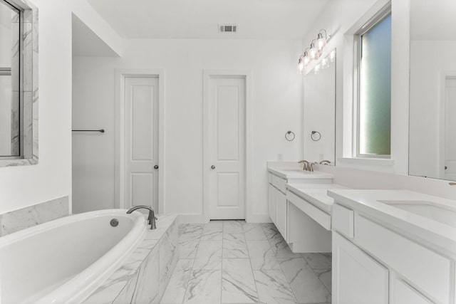 full bathroom with visible vents, marble finish floor, a sink, double vanity, and a bath