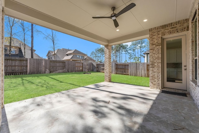 view of patio featuring a fenced backyard and a ceiling fan