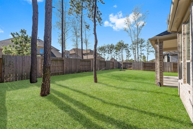 view of yard with a fenced backyard