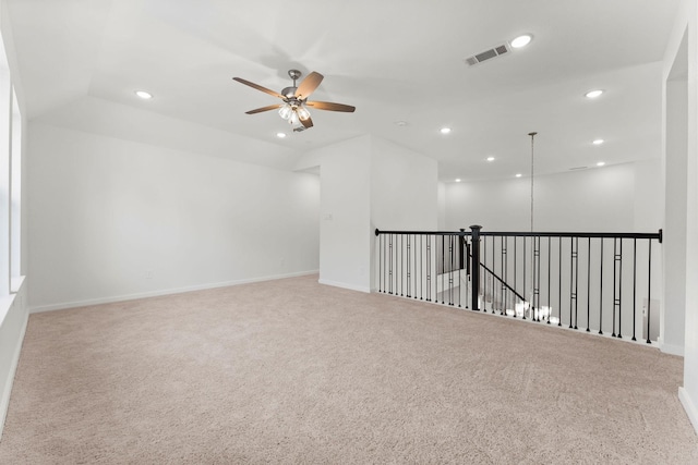 carpeted empty room featuring recessed lighting, a ceiling fan, visible vents, and baseboards