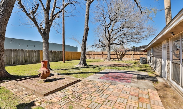 view of patio with central AC unit and a fenced backyard