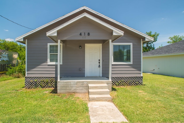 bungalow with a front lawn