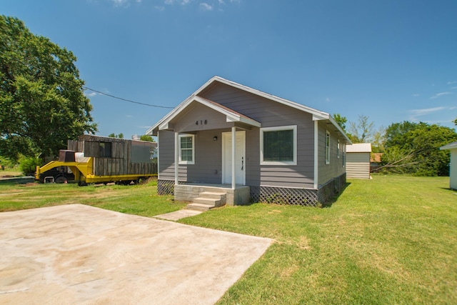 bungalow with a porch and a front yard