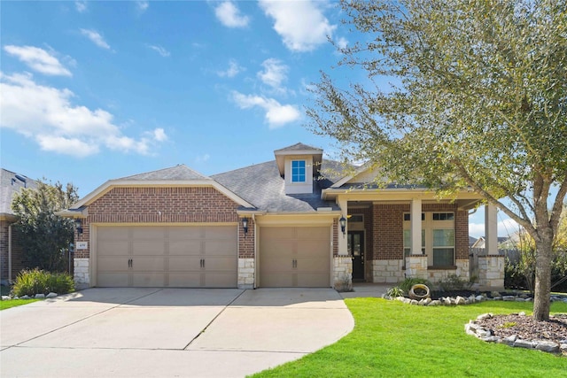 view of front of property with a front lawn, stone siding, concrete driveway, an attached garage, and brick siding