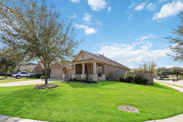 view of front of house with brick siding, concrete driveway, a front yard, and a garage