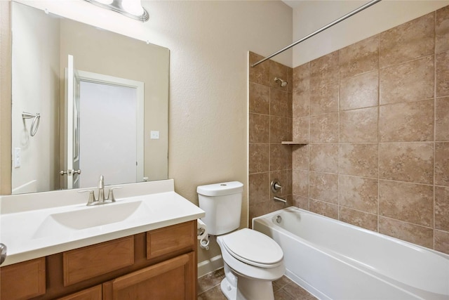 full bath with tile patterned floors, toilet, vanity, and  shower combination