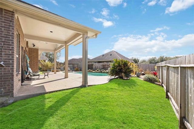 view of yard with a patio, a fenced backyard, and a fenced in pool