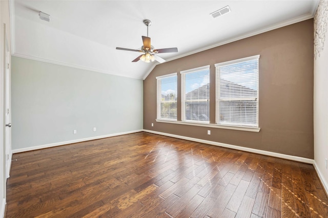 spare room with visible vents, crown molding, and dark wood-style flooring