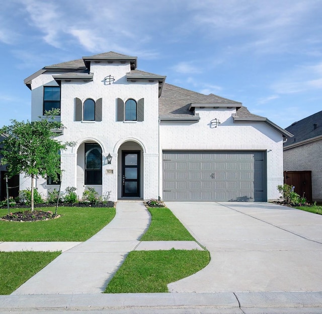 9647 Wright Dr, Manvel, TX 77578 - french provincial home with a garage, a front lawn, concrete driveway, and a shingled roof