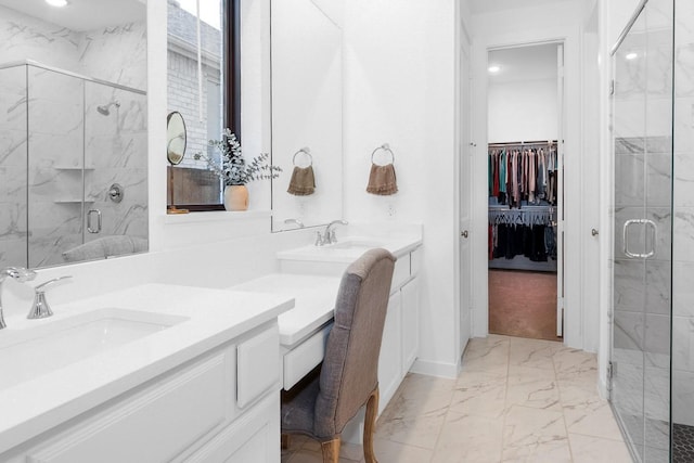 9647 Wright Dr, Manvel, TX 77578 - full bath featuring marble look tile flooring, two vanities, a shower stall, a spacious closet, and recessed lighting