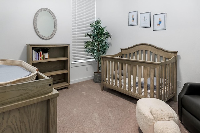 9647 Wright Dr, Manvel, TX 77578 - carpeted bedroom featuring a nursery area and baseboards