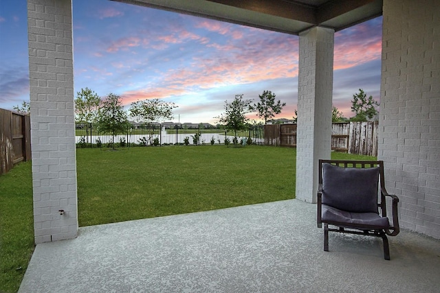 9647 Wright Dr, Manvel, TX 77578 - fenced backyard with a water view and a patio area