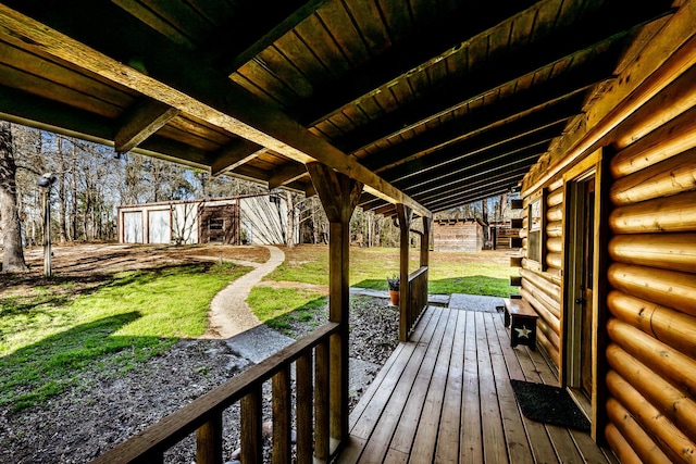 wooden terrace with a lawn