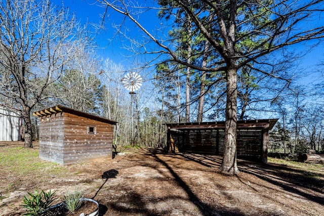 view of yard with an outdoor structure and a shed