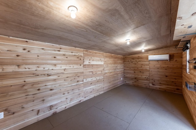 unfurnished room featuring an AC wall unit, wooden walls, wooden ceiling, and vaulted ceiling