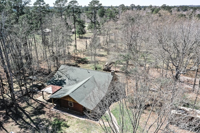 drone / aerial view with a wooded view