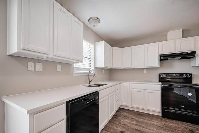 kitchen with under cabinet range hood, white cabinets, black appliances, and a sink