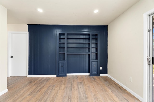 interior space featuring recessed lighting, light wood-style flooring, and baseboards