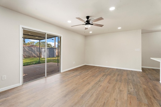 unfurnished room with recessed lighting, baseboards, wood finished floors, and ceiling fan