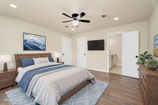 bedroom with visible vents, a ceiling fan, wood finished floors, recessed lighting, and baseboards