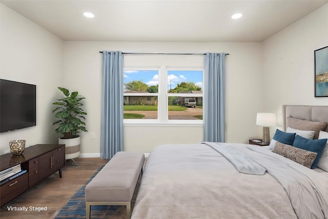 bedroom featuring recessed lighting, wood finished floors, and baseboards