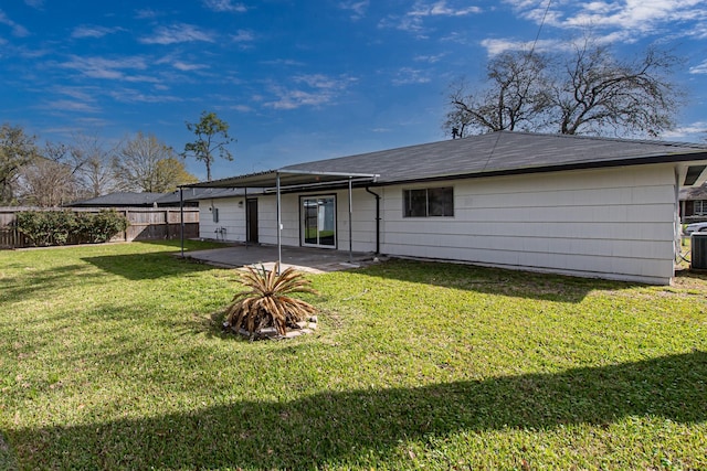 back of house with a yard, central AC unit, a patio, and fence