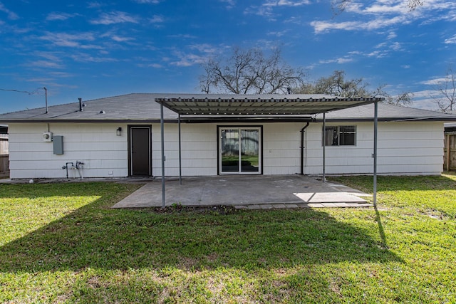 rear view of house featuring a lawn, a pergola, a patio, and fence