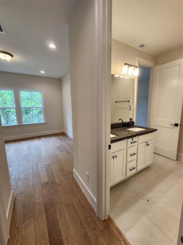 407 Forest Reserve Pl, Houston, TX 77079 - bathroom with vanity, baseboards, recessed lighting, and wood finished floors