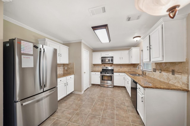 kitchen with light tile patterned flooring, visible vents, stainless steel appliances, and a sink