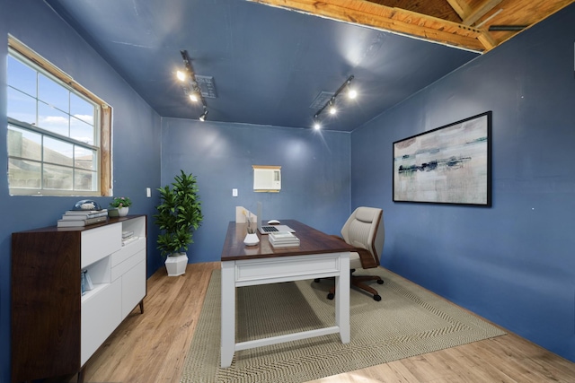 home office featuring wood finished floors and rail lighting