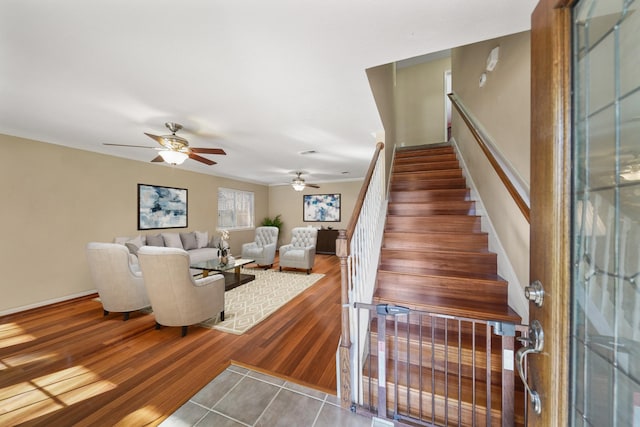 interior space featuring baseboards and wood finished floors