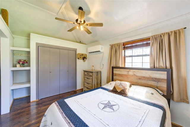 bedroom with a wall mounted air conditioner, wood finished floors, a closet, ceiling fan, and vaulted ceiling