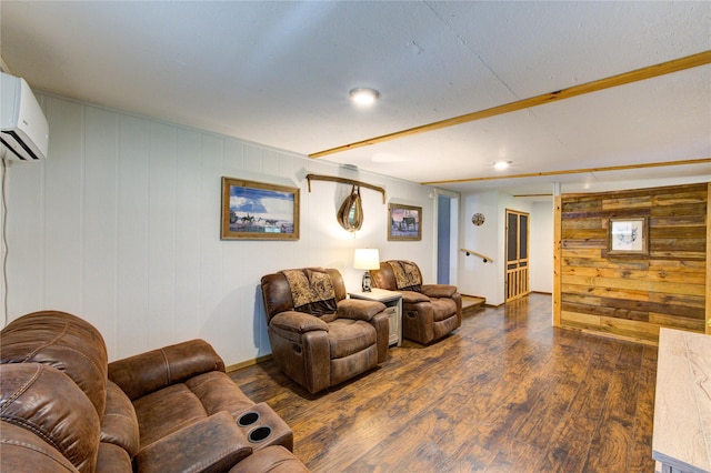 living area featuring wood finished floors and a wall unit AC