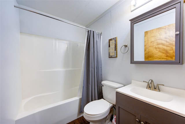 full bathroom with shower / bath combo with shower curtain, toilet, and vanity