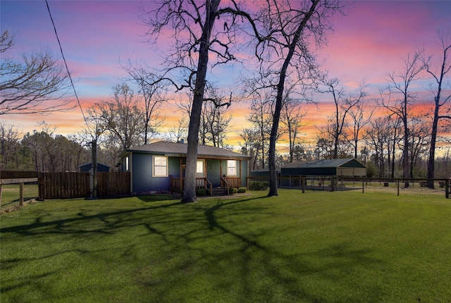 view of yard with an outbuilding and fence