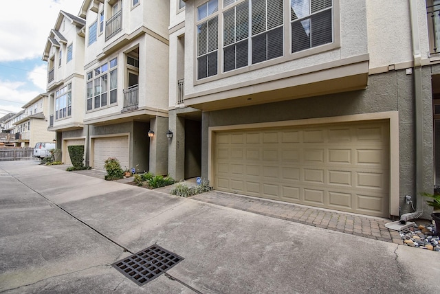 exterior space featuring a residential view and an attached garage