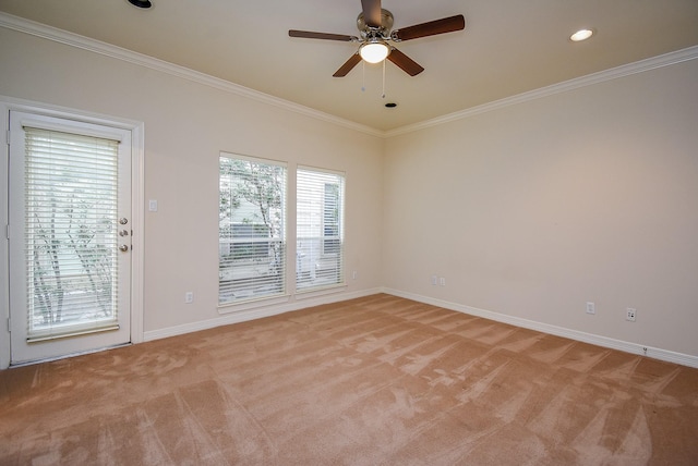 spare room featuring ceiling fan, baseboards, ornamental molding, light carpet, and recessed lighting