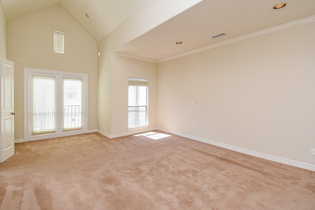 empty room with visible vents, light carpet, baseboards, and crown molding