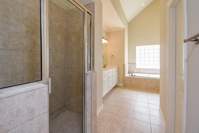 full bath featuring a shower stall, a garden tub, vaulted ceiling, tile patterned floors, and vanity