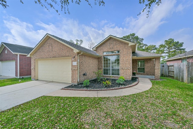 ranch-style home with fence, concrete driveway, a front yard, a garage, and brick siding