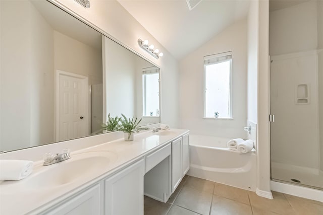 full bathroom featuring tile patterned flooring, lofted ceiling, a garden tub, double vanity, and a stall shower