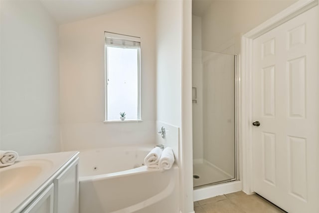 full bathroom featuring tile patterned floors, a whirlpool tub, a shower stall, lofted ceiling, and vanity