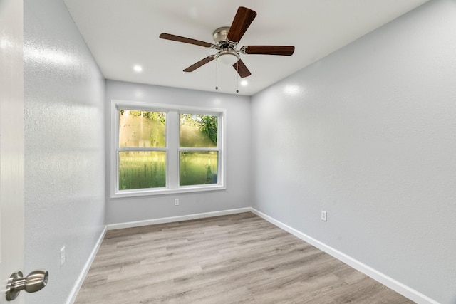 empty room with a ceiling fan, recessed lighting, baseboards, and light wood finished floors