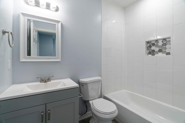 bathroom featuring tub / shower combination, toilet, vanity, and baseboards