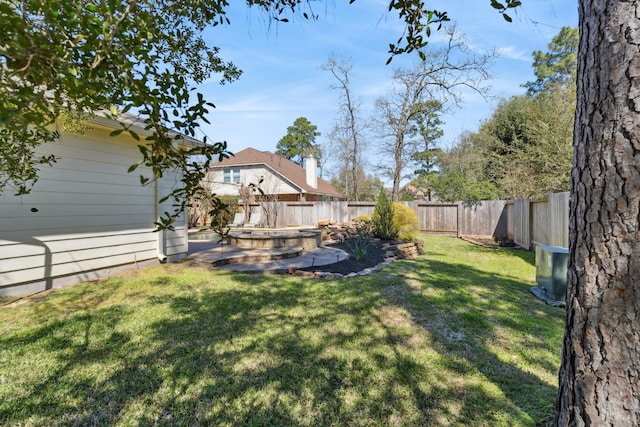 view of yard with a fenced backyard