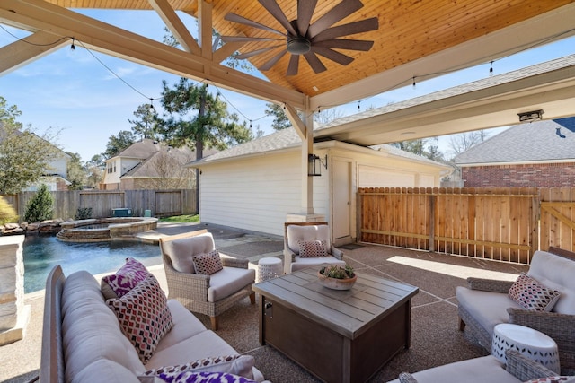 view of patio / terrace featuring a ceiling fan, an outdoor living space, a fenced backyard, and a pool with connected hot tub