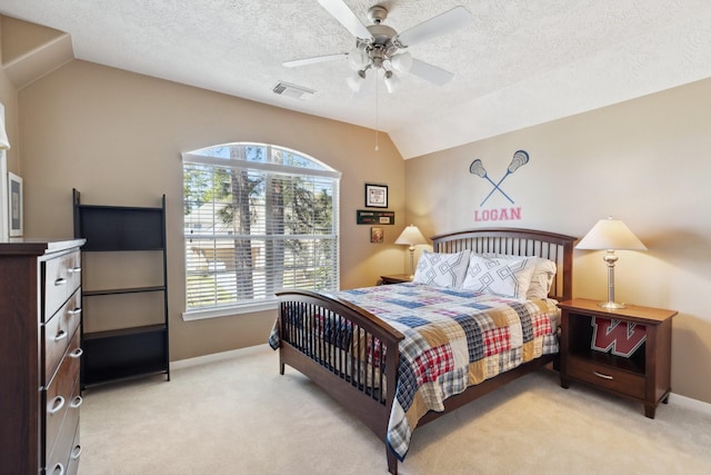 bedroom featuring visible vents, baseboards, lofted ceiling, ceiling fan, and light colored carpet