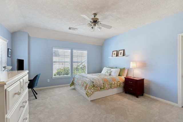 bedroom with baseboards, light colored carpet, and vaulted ceiling