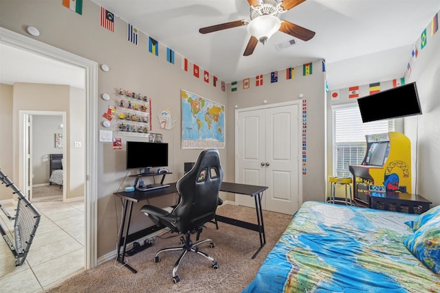 bedroom with visible vents, baseboards, ceiling fan, a closet, and tile patterned floors